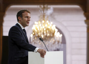French President Emmanuel Macron delivers a speech during a meeting in memory of the Algerians who fought alongside French colonial forces in Algeria's war, known as Harkis, at the Elysee Palace in Paris, Thursday, Sept. 20, 2021. Macron's speech is the latest step in his efforts to reconcile France with its dark colonial past, especially in Algeria. (Gonzalo Fuentes/Pool Photo via AP)