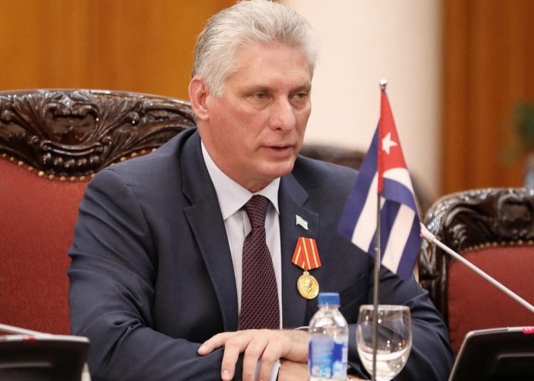 (FILES) In this file photo taken on November 09, 2018 Cuba's President Miguel Diaz-Canel Bermudez (C) speaks during a meeting with Vietnamese Prime Minister Nguyen Xuan Phuc (not pictured) at the Government Office in Hanoi. - Born after the victory of the 1959 revolution, Miguel Diaz-Canel, president and now first secretary of the Communist Party, embodies the new generation in power in Cuba, more connected but not necessarily more flexible. (Photo by LUONG THAI LINH / POOL / AFP)