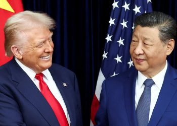 U.S. President Donald Trump and Chinese President Xi Jinping react as they hold a bilateral meeting at Gimhae International Airport, on the sidelines of the Asia-Pacific Economic Cooperation (APEC) summit, in Busan, South Korea, October 30, 2025. REUTERS/Evelyn Hockstein     TPX IMAGES OF THE DAY