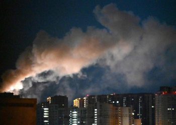 Smoke rises during a Russian missile strike on the Ukrainian capital Kyiv on July 2, 2026, amid the Russian invasion in Ukraine. Russian missile and drone strikes rocked Kyiv early on July 2, setting off fires and wounding at least five people, after President Volodymyr Zelensky warned that Moscow was preparing a "massive attack". (Photo by Sergei SUPINSKY / AFP)